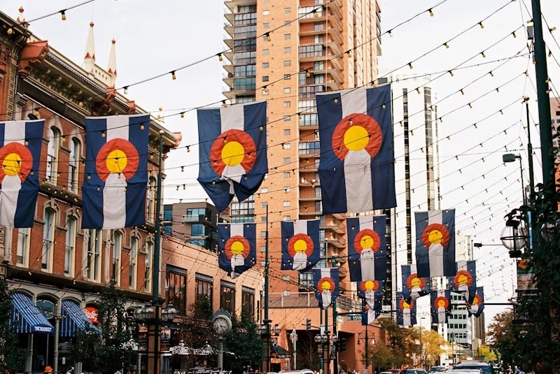 Daytime view of a street bedecked with lights and banners